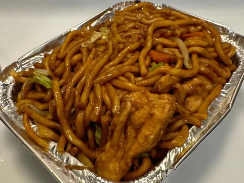 Chicken Lo Mein - Soft egg noodles stir-fried with tender chicken and fresh vegetables in our savory house sauce — a classic comfort dish.